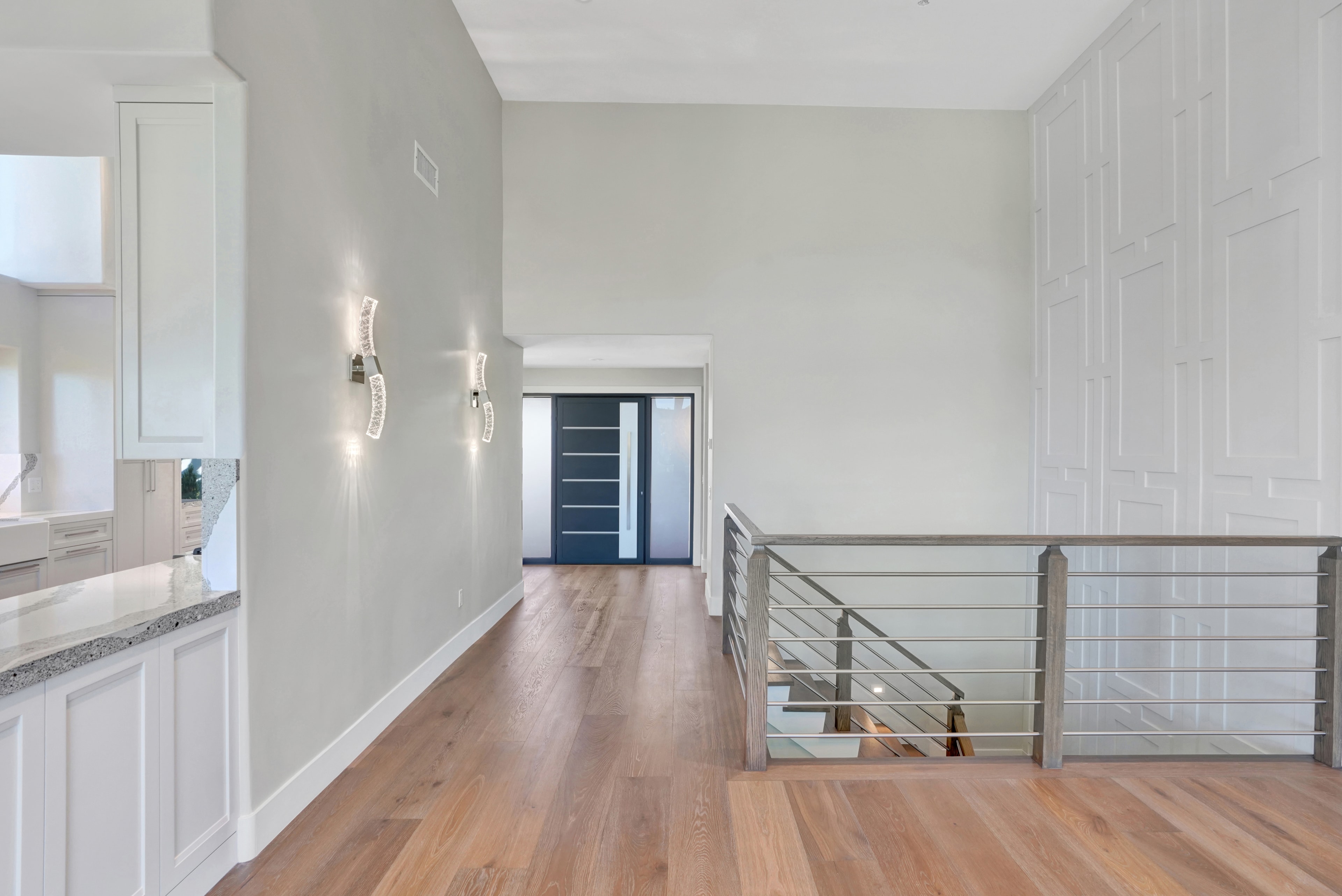 Orange County home remodel hallway with hardwood flooring by Main Street Kitchen & Flooring